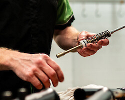 A bicycle suspension fork being serviced at Bio-Mechanics Cycles & Repairs