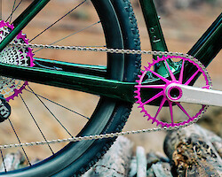 Drivetrain detail of Garbaruk bicycle components in violet, fitted to a carbon gravel bike