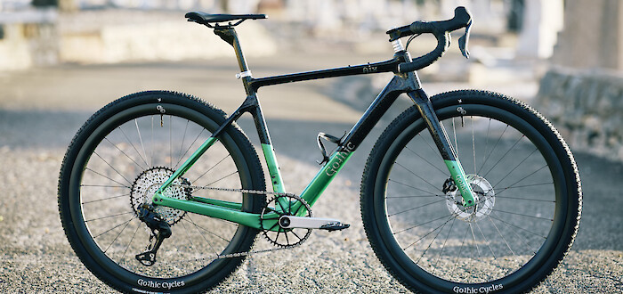 Green and black Gothic Aix carbon gravel bike, in an Adelaide graveyard
